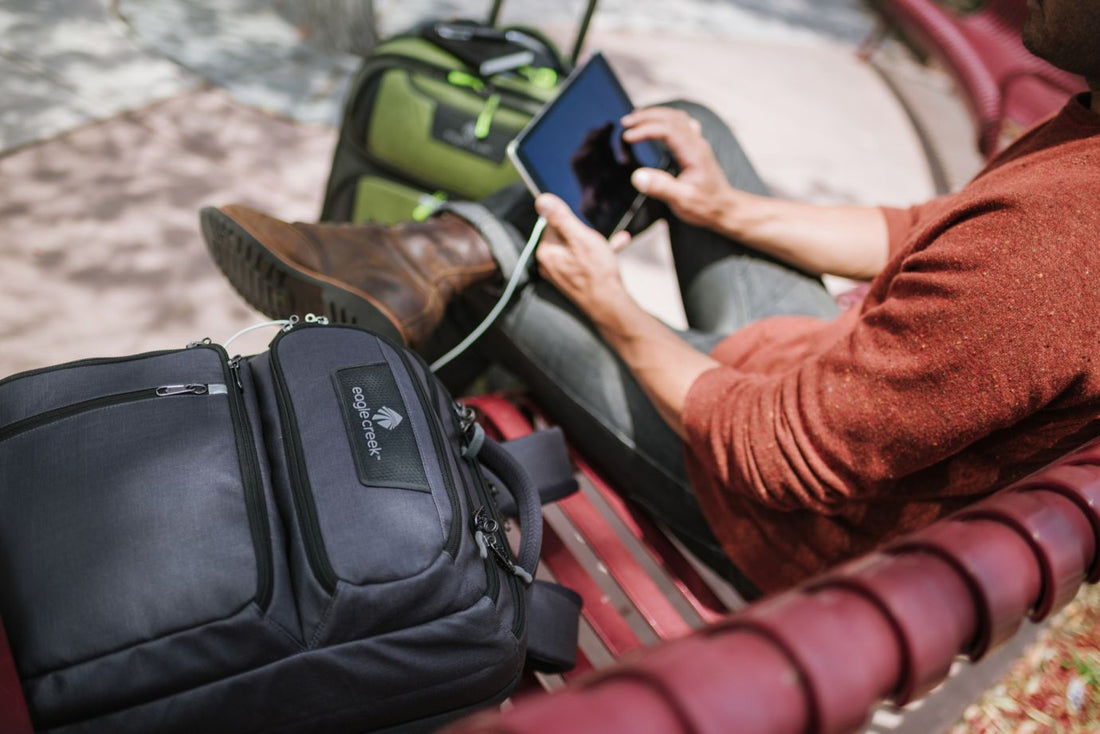 man sitting down looking at tablet