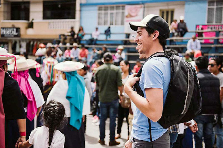 man standing in city center