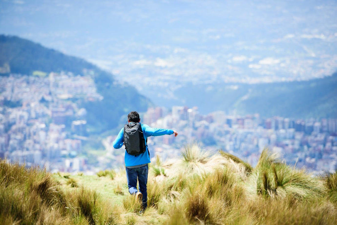 man running through hills