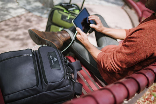 man sitting down looking at tablet