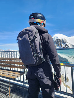 A skier wearing an Eagle Creek backpack