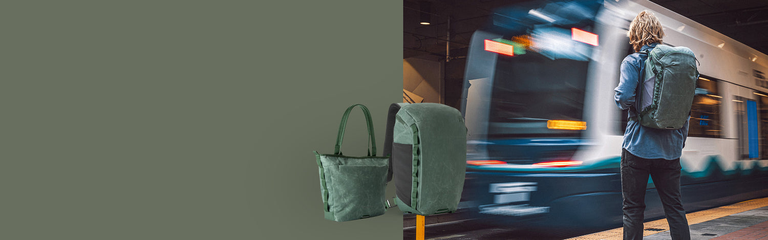 A man waits to board a train with his Eagle Creek backpack